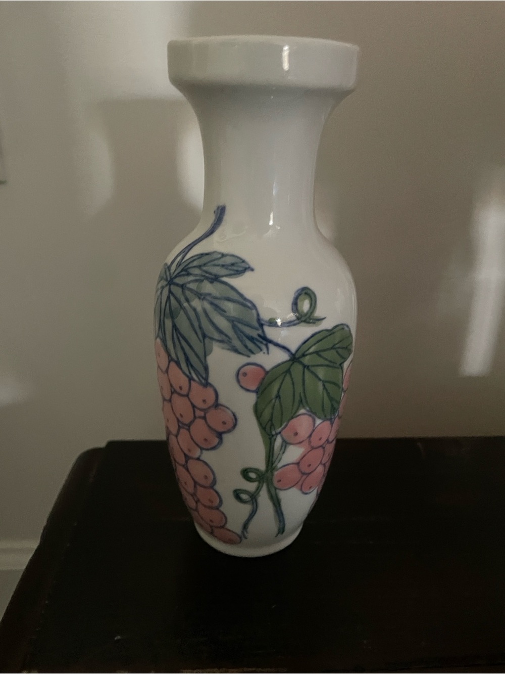 White Ceramic Vine Motif Vase with Pink Grapes